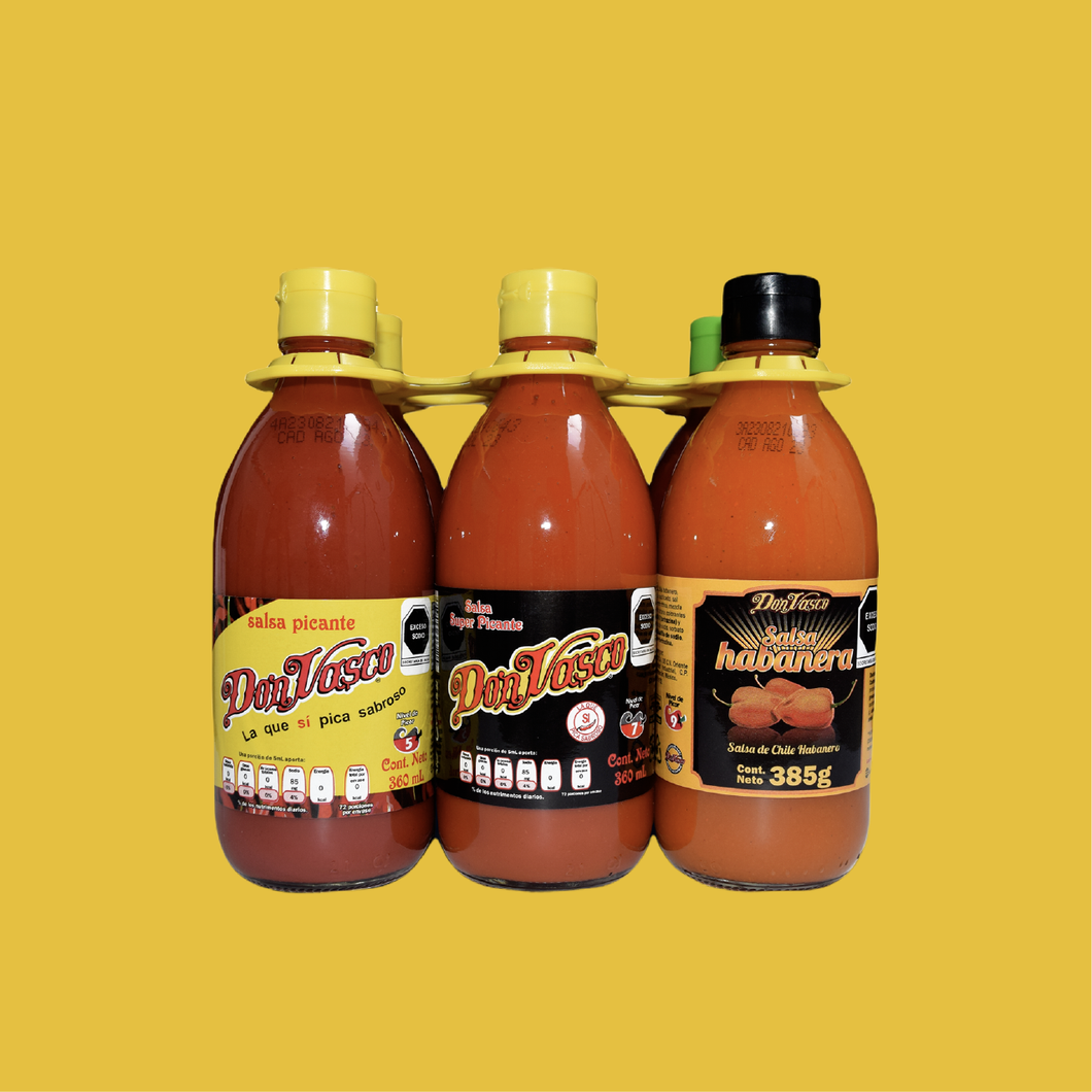 Six salsas en vidrio (2 Don Vasco, 1 E. Negra, 1 Chamoy, 1 Tarasca, 1 Habanero)